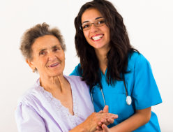 nurse and elder woman smiling
