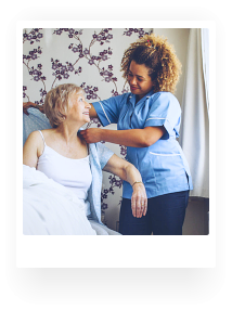 caregiver helping senior woman